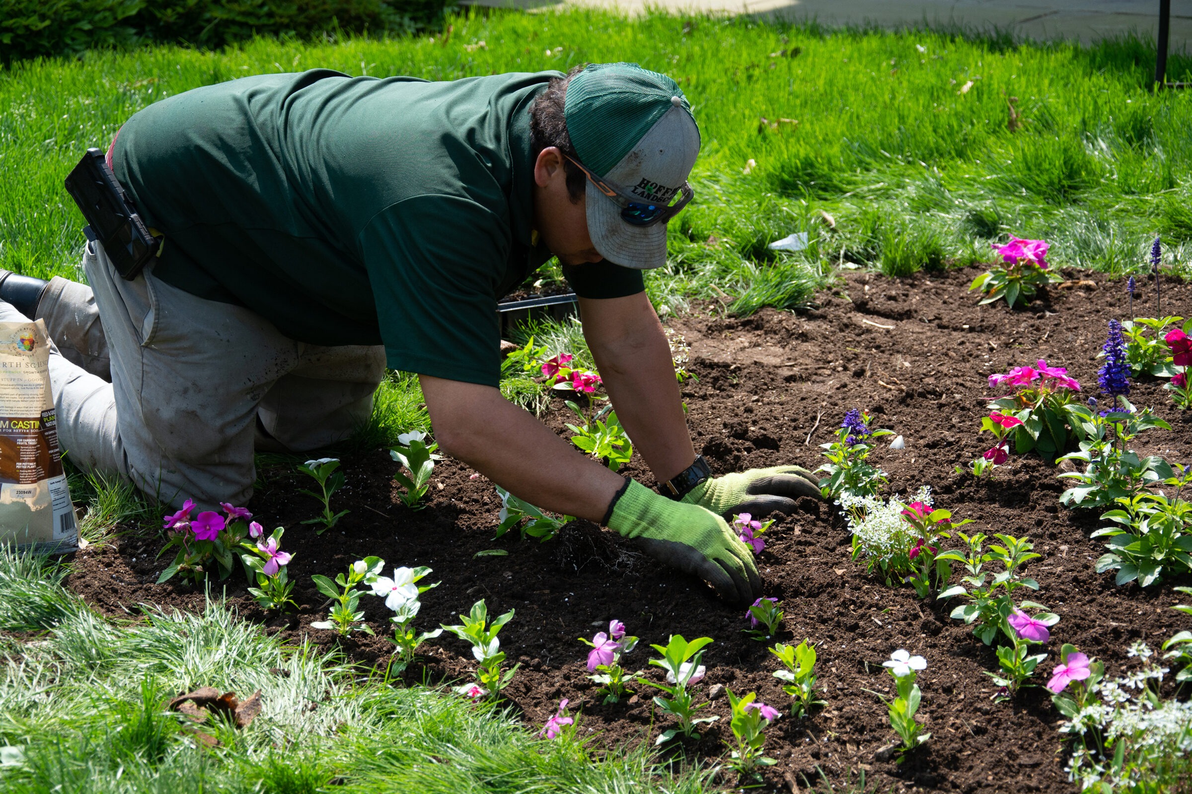 A man doing seasonal prep for a garden.