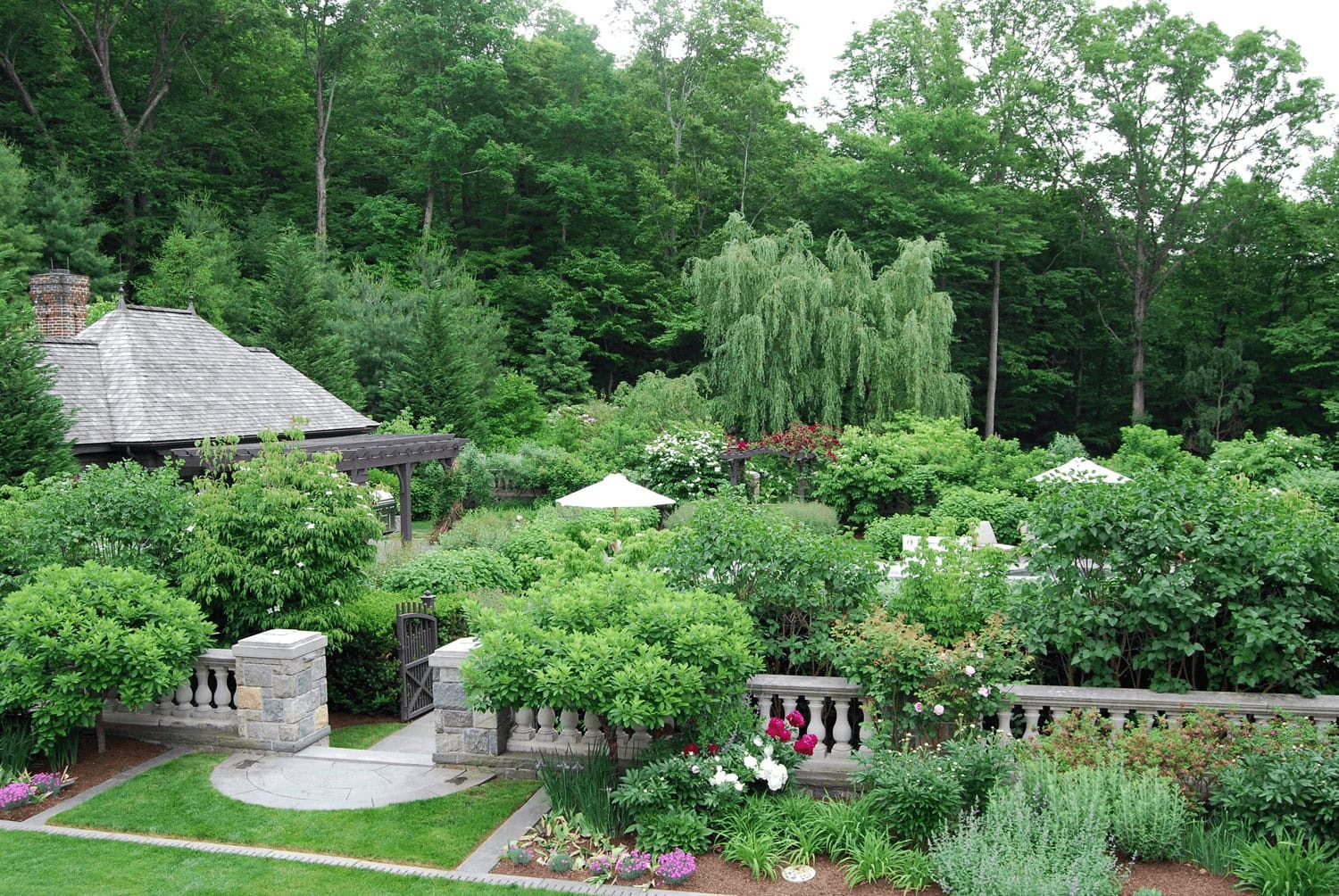 Garden gazebo surrounded by lush green trees